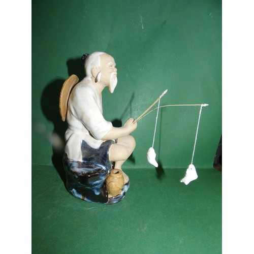 606 - JAPANESE CERAMIC FISHERMAN