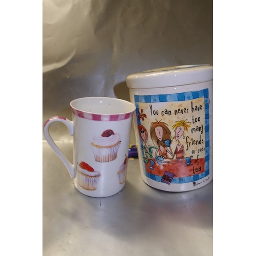 544 - 2 STAMPED MUGS  1 BORN TO SHOP