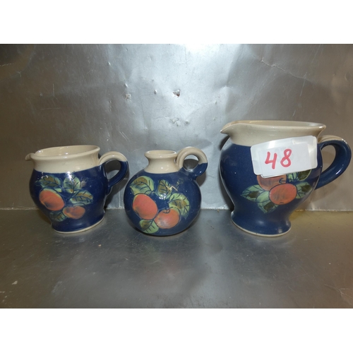 48 - BANDON POTTERY CREAMERS AND CANDLE HOLDER