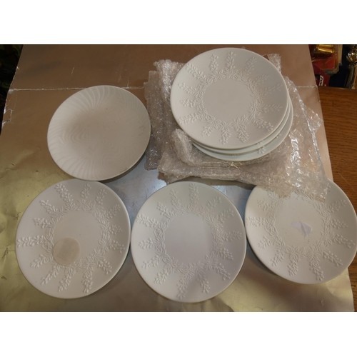 125 - 7 DECORATIVE WHITE PLATES