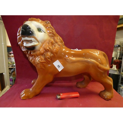 59 - LARGE STAFFORDSHIRE GLAZED PORCELAIN LION