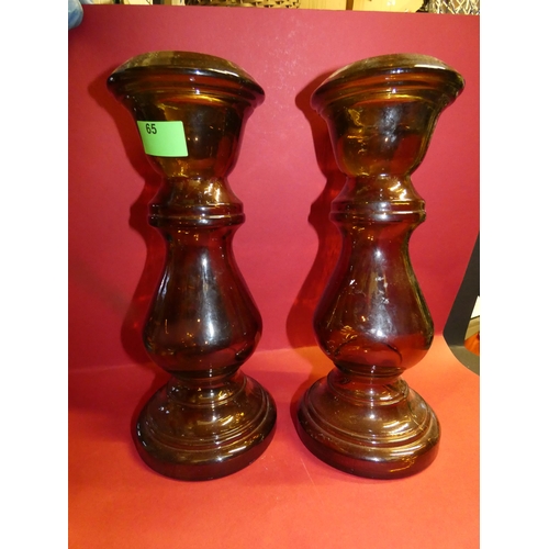 65 - 2 TALL BROWN GLASS CANDLE STICKS