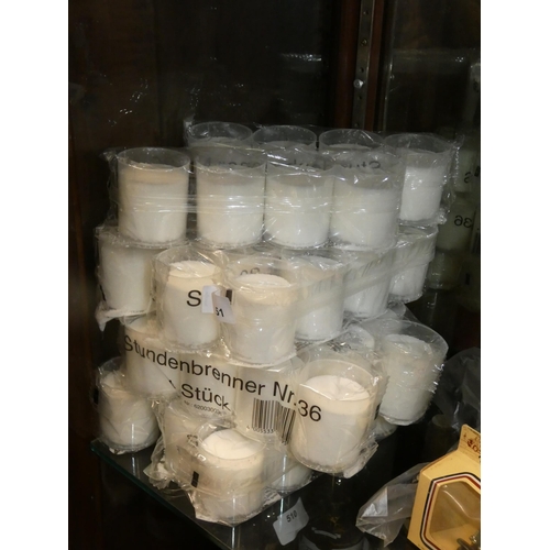 551 - LARGE QUANTITY OF WHITE BEESWAX CANDLES