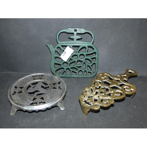 601 - 3 TRIVETS: BRASS, CAST IRON ETC