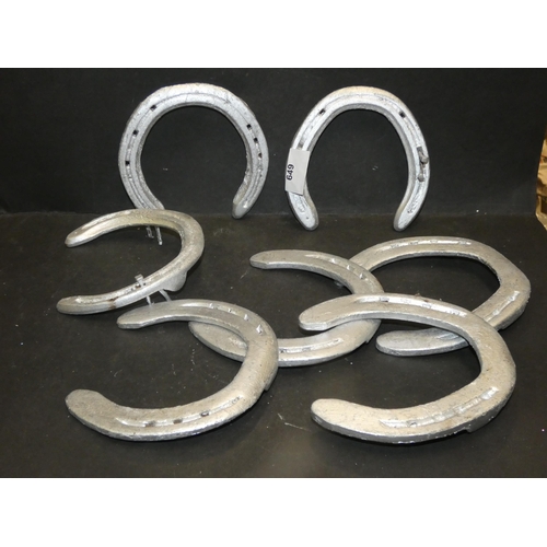 649 - 7 SILVER TONE HORSESHOES