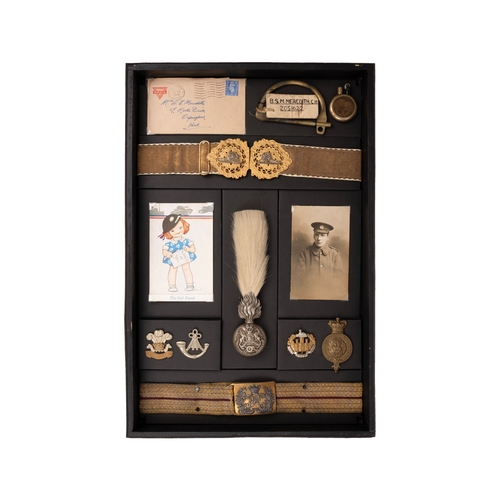 4 - Belts, Cap Badges of the Royal Artillery Welch Essex Regiment, housed in display box

*All badges et... 