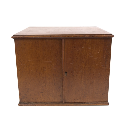 641 - A wooden coin cabinet circa 1900, 34 x 29 x 26cm., comprising of 20 trays comprising of 8x crown siz... 