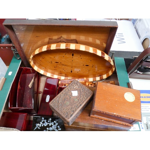 33 - A large box of wooden trays, wooden boxes and other treen