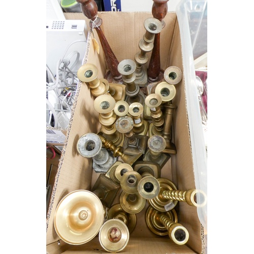 36 - A large quantity of mostly pairs of brass and other candlesticks