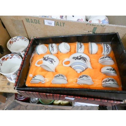 133 - A large quantity of small ceramic money boxes and an oriental coffee set