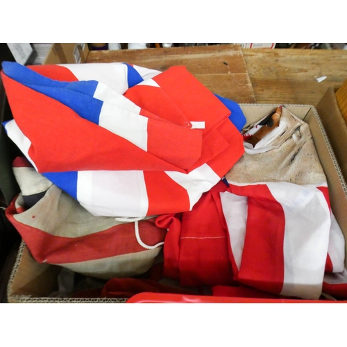 135 - A large box of various flags and a box of naval badges, emblems etc