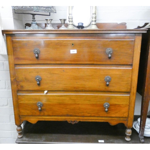 388 - An Edwardian walnut chest of three long drawers 34