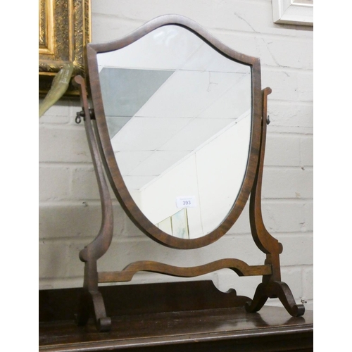 393 - A Georgian style mahogany shield shaped dressing table mirror