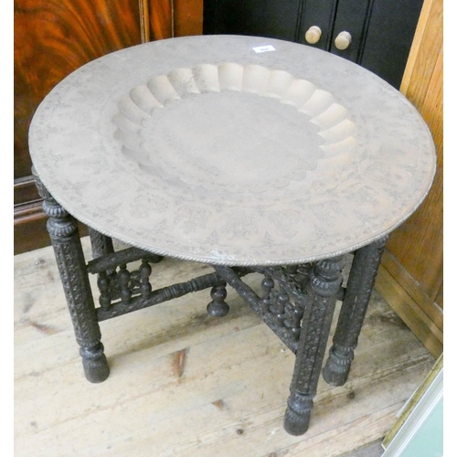 400 - circular Benares brass tiffin table on carved wood folding stand