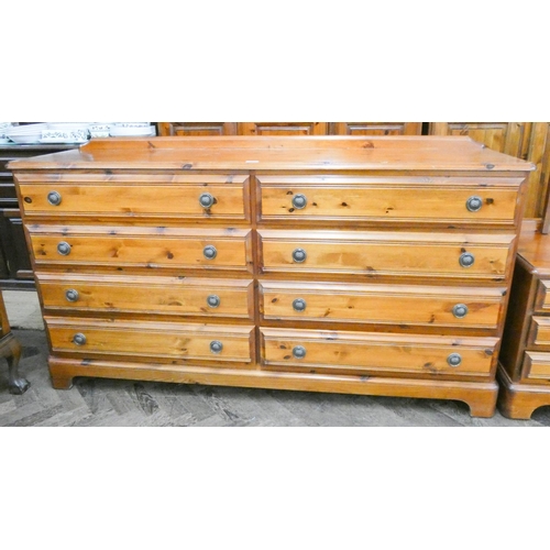 472 - A long Ducal pine chest of eight drawers, 5'6 wide