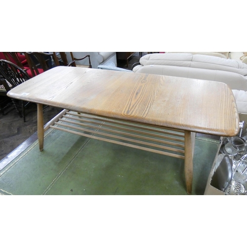 484 - An Ercol light elm two tier coffee table