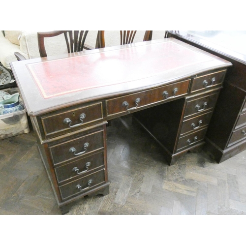 487 - A reproduction mahogany double pedestal kneehole desk with red leather top 4' wide