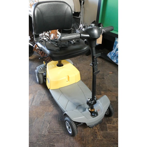 5 - Small 4 wheeled mega motion elite 8 mobility scooter with yellow and grey bodywork - complete with c... 