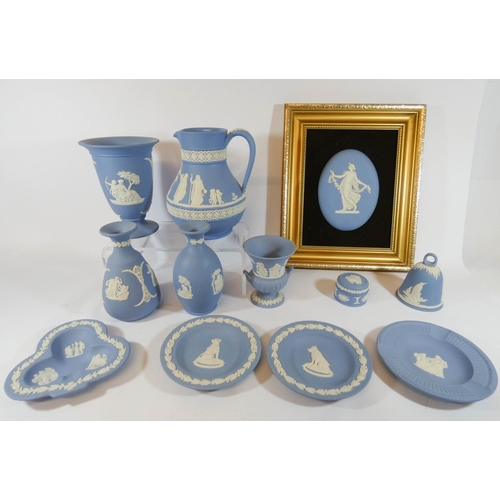 501 - A collection of Wedgwood blue Jasper wares to include jugs, vases, in trays and dancing hours plaque