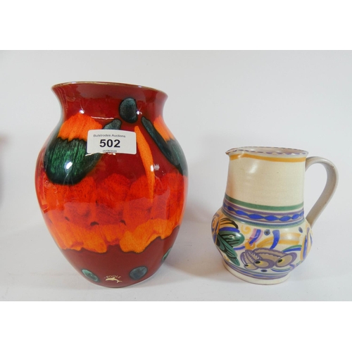 502 - A Carter Stabler Adams Poole Pottery jug in floral pattern GX and Poole Pottery Delphis vase, Delphi... 