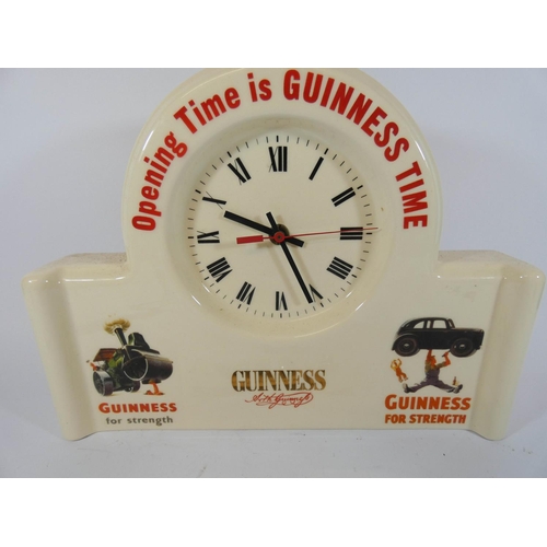 509 - A Guinness advertising mantel clock and a collection of Guinness waistcoat buttons