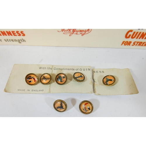 509 - A Guinness advertising mantel clock and a collection of Guinness waistcoat buttons