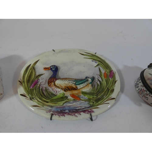 511 - Two enameled table snuff boxes and a pearl ware plaque depicting a duck amongst reeds, the plaque me... 