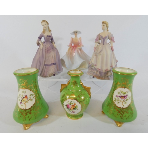 549 - A miniature Coalport garniture of vases and three lady figures