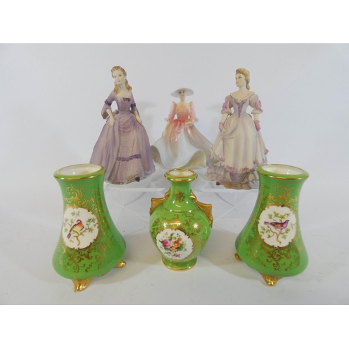 549 - A miniature Coalport garniture of vases and three lady figures