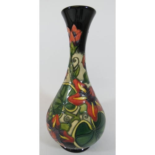 491 - A modern Moorcroft vase decorated with passion flowers, dated 1999, height 24cms