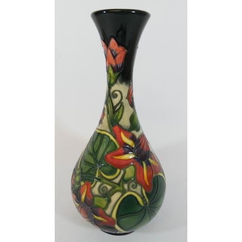 491 - A modern Moorcroft vase decorated with passion flowers, dated 1999, height 24cms