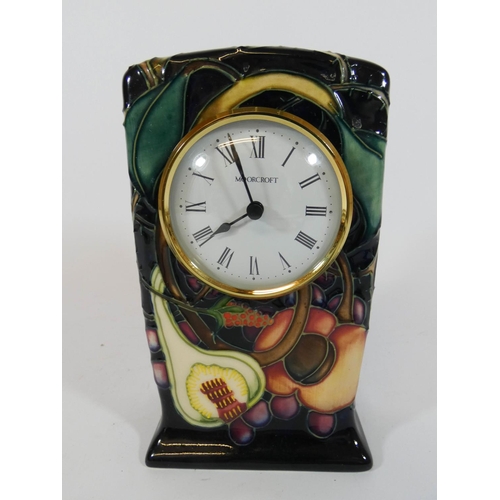 496 - A modern Moorcroft mantel clock in the pomegranate design