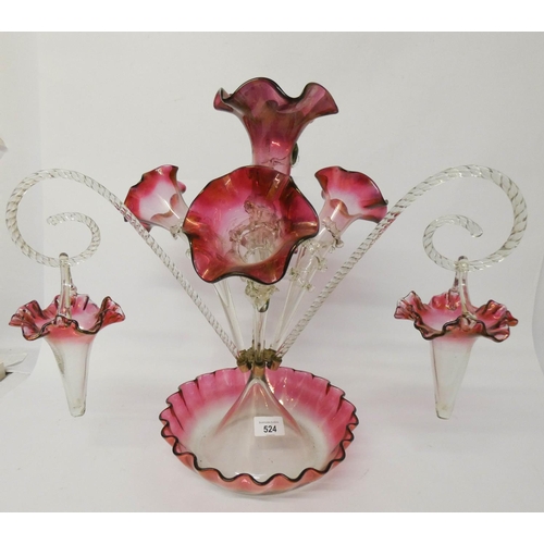 574 - A frilled clear and cranberry tinged glass epergne, with trumpets and baskets, 42 cms tall