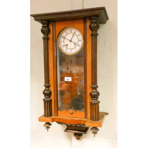 286 - An Edwardian Vienna style striking wall clock in walnut and glazed case