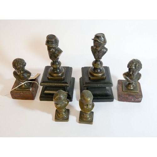 477 - Three pairs of 19th century bronze mounted bust desk paperweights depicting children, tallest measur... 