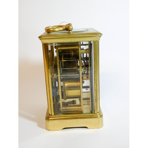 577 - A French gilt brass striking carriage clock with key, white enamel dial signed Maigret Paris, height... 