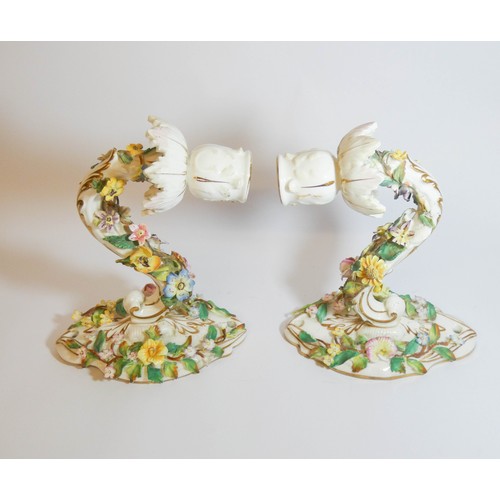 579 - A pair of 19th century Dresden floral encrusted wall sconces, blue cross sword mark on reverse