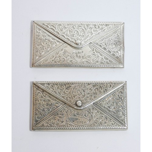 455 - Two very similar hallmark silver envelope card cases with engraved decoration, each measuring 8cms a... 