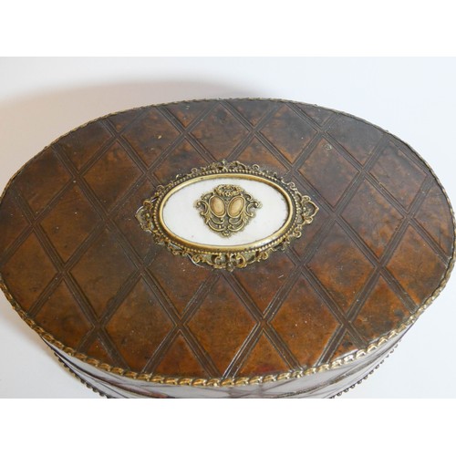 461 - An antique oval leather and mother of pearl inlaid gilt metal mounted jewellery casket measuring 18c... 