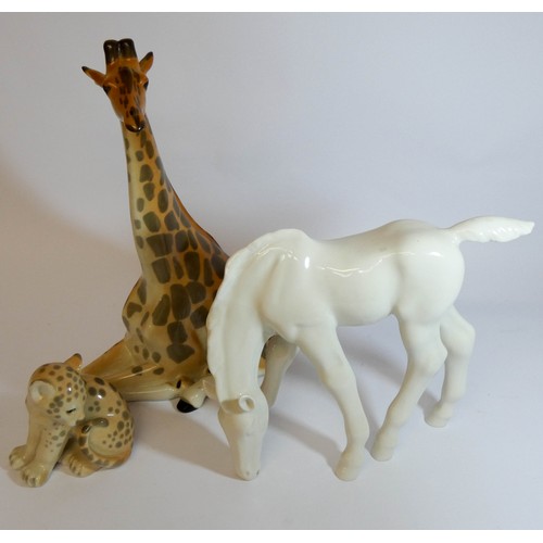 446 - A collection of three Russian porcelain animals, horse, leopard cub and a giraffe