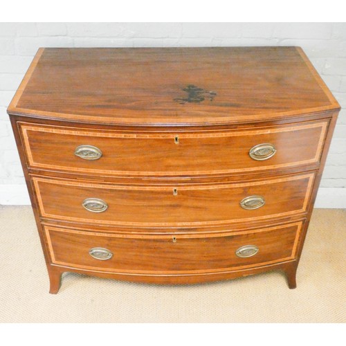 806 - A Georgian mahogany bow front chest of three long drawers with satin banded top and drawers standing... 