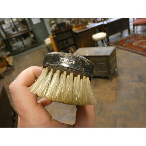 616 - Chinese export silver three piece dressing table set comprising hand mirror and two brushes, makers ... 