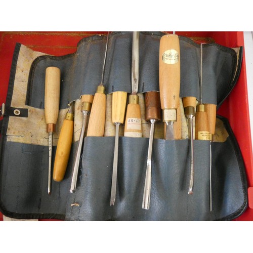 56 - A Hilti gun box containing sets of wood working chisels