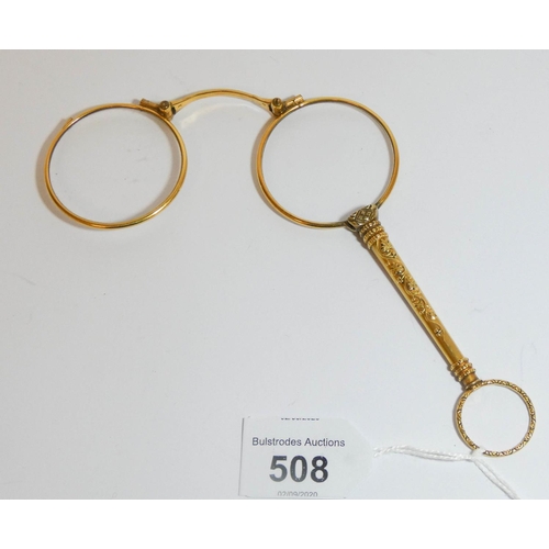 538 - A 19th century yellow metal lorgnette,  12cms long