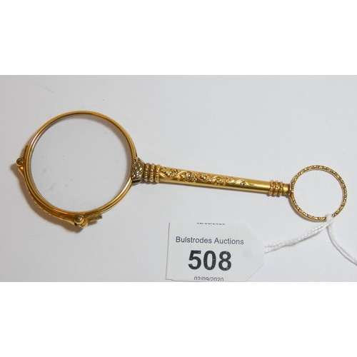 538 - A 19th century yellow metal lorgnette,  12cms long