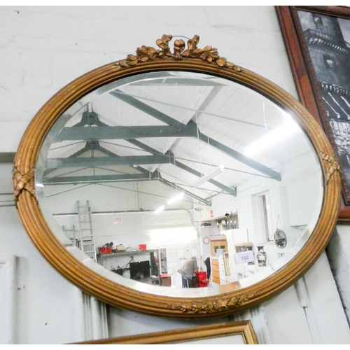 120 - A late Victorian oval bevelled wall mirror in gilt frame