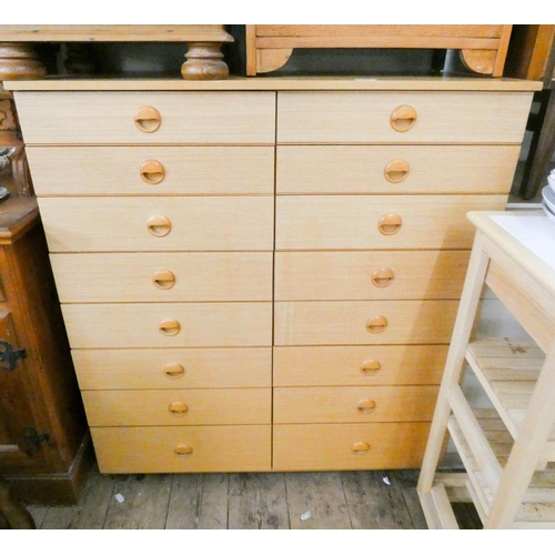 124 - Schreiber pale teak finished chest of sixteen drawers, 40