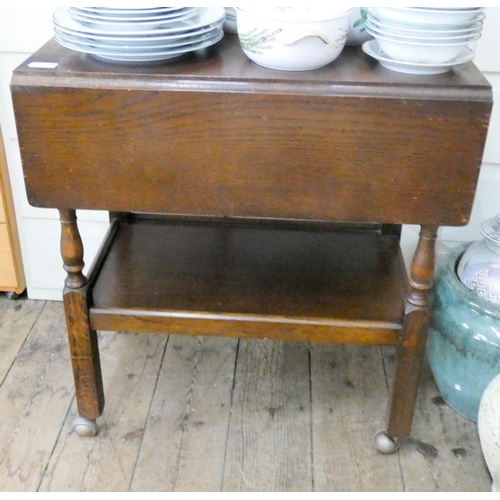 129 - A two tier oak drop leaf tea trolley