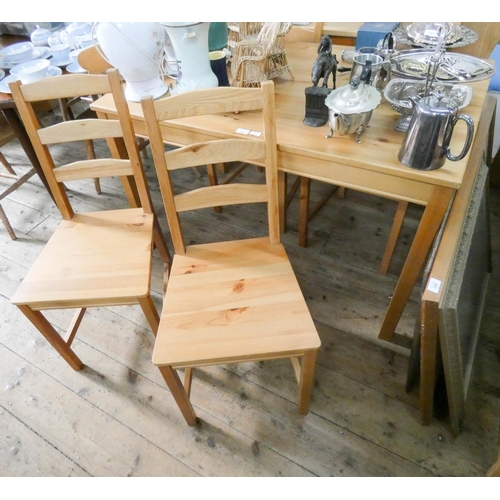 143 - A modern pine dining or breakfast table, 4' x 2'6, together with a set of four pine leather backed s... 