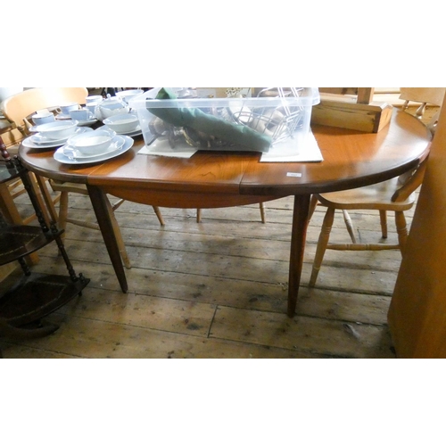 157 - A 1970's G plan teak extending dining table with centre leaf